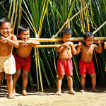 **Image Prompt:** A group of Tongan children playing 'teka' (hide-and-seek) under the bright sun, showcasing the strategy and physical activity involved.